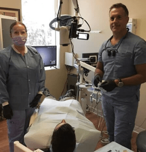 Man and woman preparing for dental operation