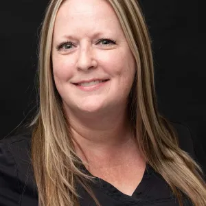 Smiling woman in black shirt
